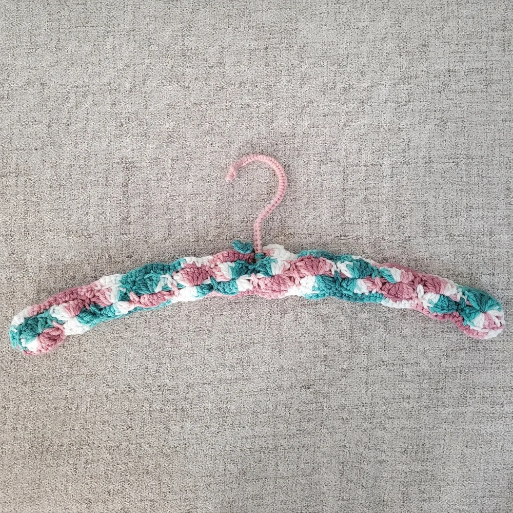Vintage handmade knit clothing hanger